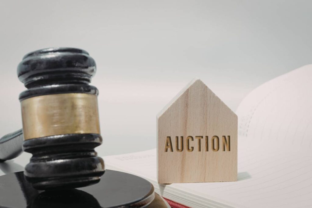 buying property at auction Melbourne finance 2026 — couple bidding confidently with pre-approval ready
