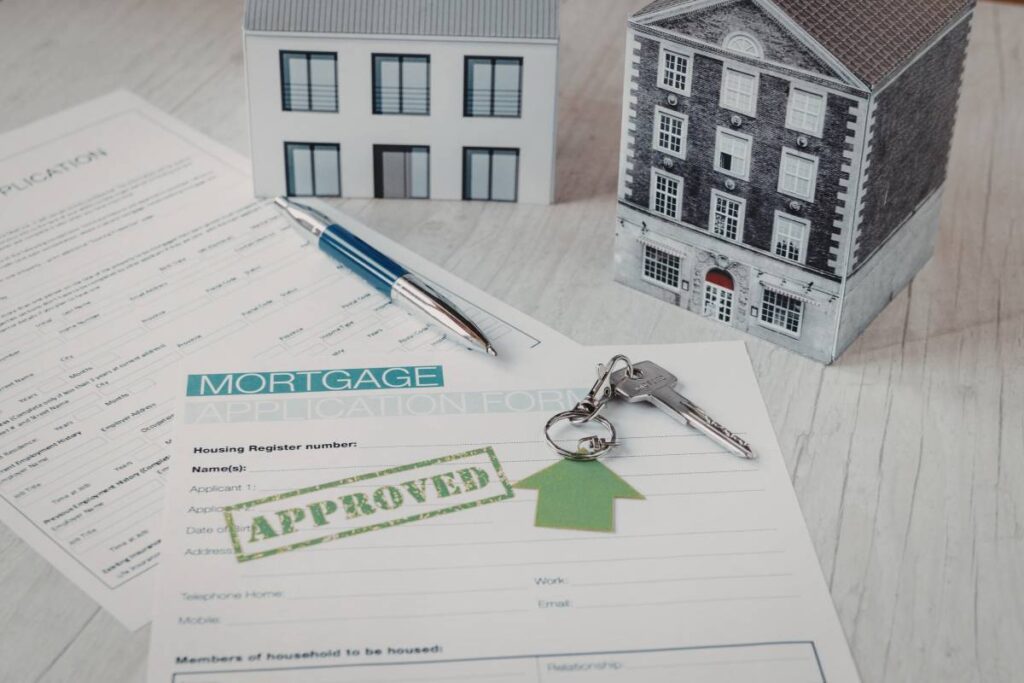 home loan pre-approval vs conditional approval Melbourne - couple reviewing documents with mortgage broker